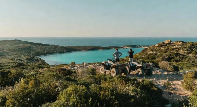 Quad bikes on an off-road trail overlooking the turquoise waters of the Costa Smeralda on a sardinia cycling and adventure tour in northern Sardinia