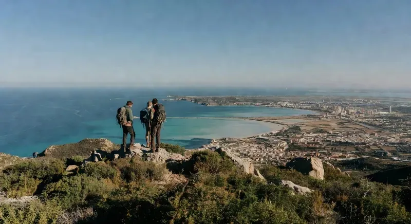 Cyclist and hiker at the Devil's Saddle viewpoint overlooking the Gulf of Angels on a sardinia cycling and hiking tour from Cagliari